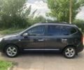 Серый Киа Каренс, объемом двигателя 2 л и пробегом 350 тыс. км за 4900 $, фото 3 на Automoto.ua