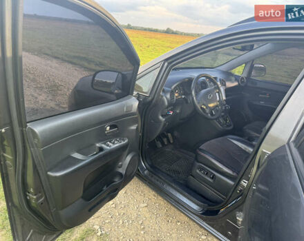 Серый Киа Каренс, объемом двигателя 2 л и пробегом 300 тыс. км за 6900 $, фото 5 на Automoto.ua