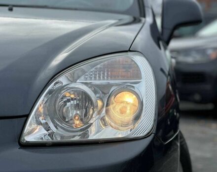 Серый Киа Каренс, объемом двигателя 2 л и пробегом 203 тыс. км за 5999 $, фото 3 на Automoto.ua