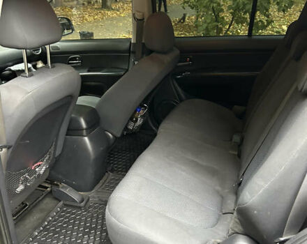 Серый Киа Каренс, объемом двигателя 1.58 л и пробегом 220 тыс. км за 8300 $, фото 14 на Automoto.ua