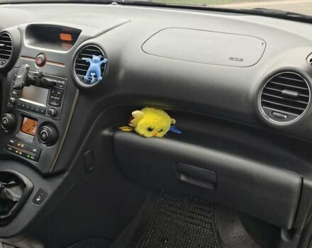 Серый Киа Каренс, объемом двигателя 2 л и пробегом 49 тыс. км за 10000 $, фото 1 на Automoto.ua