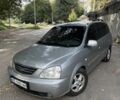 Серый Киа Каренс, объемом двигателя 2 л и пробегом 240 тыс. км за 3540 $, фото 1 на Automoto.ua