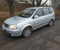 Серый Киа Каренс, объемом двигателя 2 л и пробегом 220 тыс. км за 1850 $, фото 1 на Automoto.ua