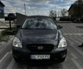 Серый Киа Каренс, объемом двигателя 2 л и пробегом 228 тыс. км за 4800 $, фото 1 на Automoto.ua