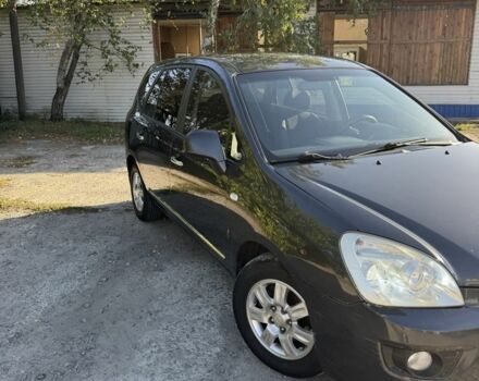 Серый Киа Каренс, объемом двигателя 2 л и пробегом 273 тыс. км за 5000 $, фото 2 на Automoto.ua