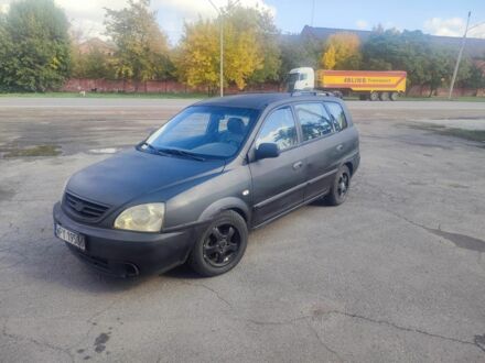 Серый Киа Каренс, объемом двигателя 2 л и пробегом 260 тыс. км за 1000 $, фото 1 на Automoto.ua