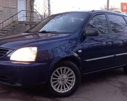 Синий Киа Каренс, объемом двигателя 2 л и пробегом 190 тыс. км за 4700 $, фото 3 на Automoto.ua