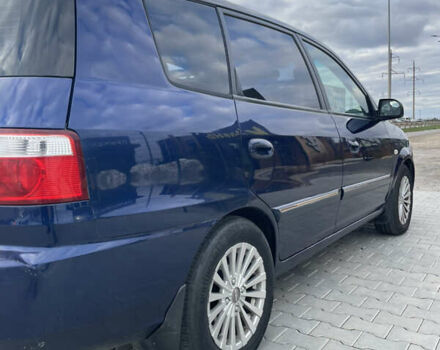 Синий Киа Каренс, объемом двигателя 2 л и пробегом 187 тыс. км за 3900 $, фото 2 на Automoto.ua