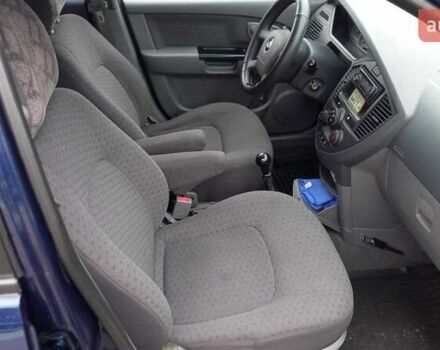 Синий Киа Каренс, объемом двигателя 2 л и пробегом 190 тыс. км за 4800 $, фото 13 на Automoto.ua