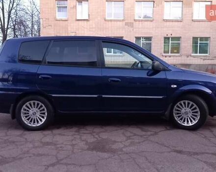 Синий Киа Каренс, объемом двигателя 2 л и пробегом 190 тыс. км за 4700 $, фото 1 на Automoto.ua