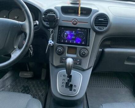 Синий Киа Каренс, объемом двигателя 2 л и пробегом 234 тыс. км за 6500 $, фото 1 на Automoto.ua