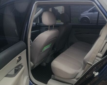 Синий Киа Каренс, объемом двигателя 2 л и пробегом 244 тыс. км за 6000 $, фото 6 на Automoto.ua