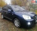 Синий Киа Каренс, объемом двигателя 2 л и пробегом 244 тыс. км за 6000 $, фото 1 на Automoto.ua