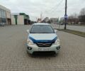 Синій Кіа Каренс, об'ємом двигуна 2 л та пробігом 180 тис. км за 5500 $, фото 1 на Automoto.ua