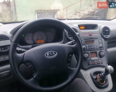 Синий Киа Каренс, объемом двигателя 2 л и пробегом 244 тыс. км за 6000 $, фото 4 на Automoto.ua