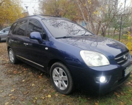 Синий Киа Каренс, объемом двигателя 2 л и пробегом 244 тыс. км за 6000 $, фото 1 на Automoto.ua