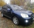 Синий Киа Каренс, объемом двигателя 2 л и пробегом 244 тыс. км за 6000 $, фото 1 на Automoto.ua