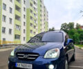Синій Кіа Каренс, об'ємом двигуна 2 л та пробігом 236 тис. км за 5400 $, фото 1 на Automoto.ua