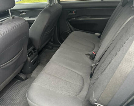 Синій Кіа Каренс, об'ємом двигуна 2 л та пробігом 190 тис. км за 5950 $, фото 13 на Automoto.ua