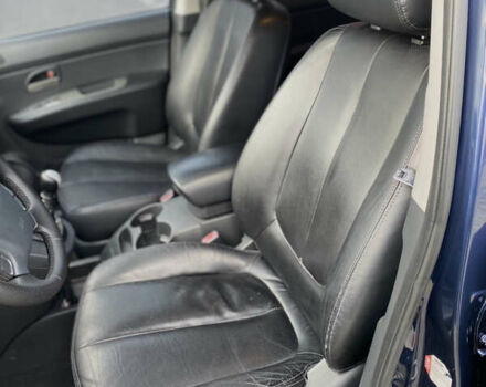 Синій Кіа Каренс, об'ємом двигуна 1.99 л та пробігом 251 тис. км за 6699 $, фото 31 на Automoto.ua