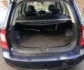 Синий Киа Каренс, объемом двигателя 2 л и пробегом 232 тыс. км за 5800 $, фото 13 на Automoto.ua