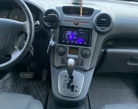 Синий Киа Каренс, объемом двигателя 2 л и пробегом 234 тыс. км за 6500 $, фото 2 на Automoto.ua