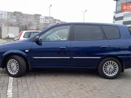 Синій Кіа Каренс, об'ємом двигуна 2 л та пробігом 190 тис. км за 4800 $, фото 1 на Automoto.ua