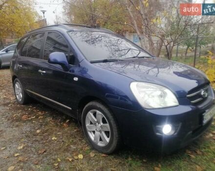 Синий Киа Каренс, объемом двигателя 2 л и пробегом 244 тыс. км за 6000 $, фото 1 на Automoto.ua