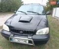Черный Киа Карнивал, объемом двигателя 2.9 л и пробегом 320 тыс. км за 2200 $, фото 1 на Automoto.ua