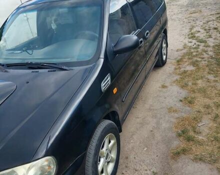 Черный Киа Карнивал, объемом двигателя 2.9 л и пробегом 294 тыс. км за 4000 $, фото 2 на Automoto.ua