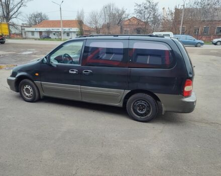 Черный Киа Карнивал, объемом двигателя 2.9 л и пробегом 260 тыс. км за 1500 $, фото 3 на Automoto.ua