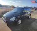 Черный Киа Карнивал, объемом двигателя 2.66 л и пробегом 310 тыс. км за 5800 $, фото 1 на Automoto.ua