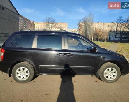 Черный Киа Карнивал, объемом двигателя 2.66 л и пробегом 310 тыс. км за 5800 $, фото 2 на Automoto.ua