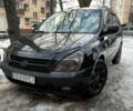 Черный Киа Карнивал, объемом двигателя 2.7 л и пробегом 255 тыс. км за 4450 $, фото 1 на Automoto.ua