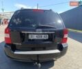 Черный Киа Карнивал, объемом двигателя 2.9 л и пробегом 284 тыс. км за 6200 $, фото 2 на Automoto.ua