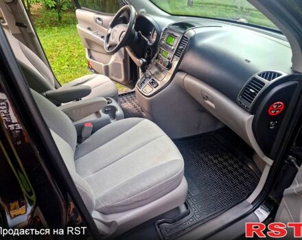 Черный Киа Карнивал, объемом двигателя 2.7 л и пробегом 215 тыс. км за 6500 $, фото 12 на Automoto.ua