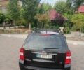 Черный Киа Карнивал, объемом двигателя 2.9 л и пробегом 279 тыс. км за 5850 $, фото 1 на Automoto.ua