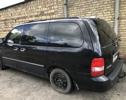 Черный Киа Карнивал, объемом двигателя 2.9 л и пробегом 200 тыс. км за 2000 $, фото 1 на Automoto.ua