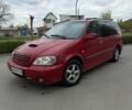 Красный Киа Карнивал, объемом двигателя 2.9 л и пробегом 300 тыс. км за 2700 $, фото 1 на Automoto.ua