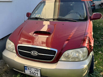 Красный Киа Карнивал, объемом двигателя 2.9 л и пробегом 250 тыс. км за 6000 $, фото 1 на Automoto.ua