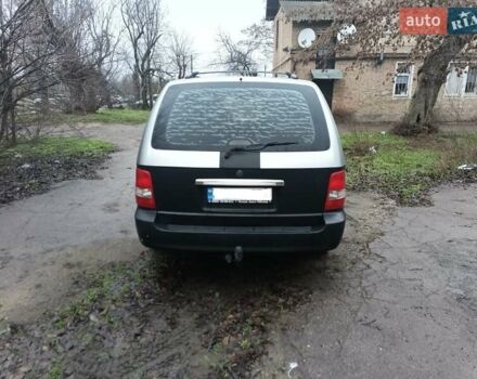 Серый Киа Карнивал, объемом двигателя 2.9 л и пробегом 348 тыс. км за 4300 $, фото 3 на Automoto.ua