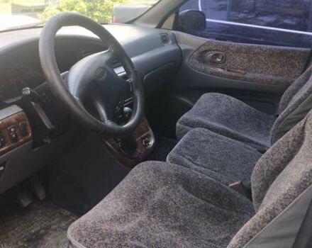 Синій Кіа Карнівал, об'ємом двигуна 2.92 л та пробігом 300 тис. км за 1999 $, фото 3 на Automoto.ua