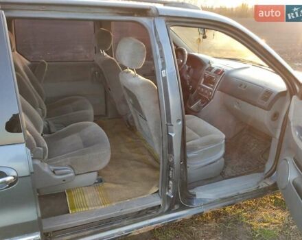 Синий Киа Карнивал, объемом двигателя 2.9 л и пробегом 240 тыс. км за 2450 $, фото 4 на Automoto.ua