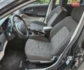Черный Киа Сид, объемом двигателя 1.4 л и пробегом 243 тыс. км за 5400 $, фото 4 на Automoto.ua