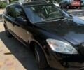 Черный Киа Сид, объемом двигателя 1.4 л и пробегом 184 тыс. км за 6100 $, фото 1 на Automoto.ua