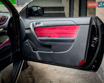 Чорний Кіа Cerato KOUP, об'ємом двигуна 2 л та пробігом 265 тис. км за 6800 $, фото 25 на Automoto.ua
