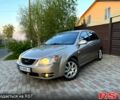 Бежевый Киа Черато, объемом двигателя 2 л и пробегом 255 тыс. км за 4950 $, фото 1 на Automoto.ua