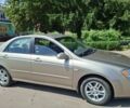 Бежевий Кіа Черато, об'ємом двигуна 2 л та пробігом 146 тис. км за 4500 $, фото 17 на Automoto.ua