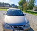 Бежевый Киа Черато, объемом двигателя 2 л и пробегом 278 тыс. км за 4450 $, фото 1 на Automoto.ua