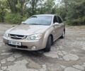 Бежевый Киа Черато, объемом двигателя 2 л и пробегом 197 тыс. км за 5300 $, фото 1 на Automoto.ua